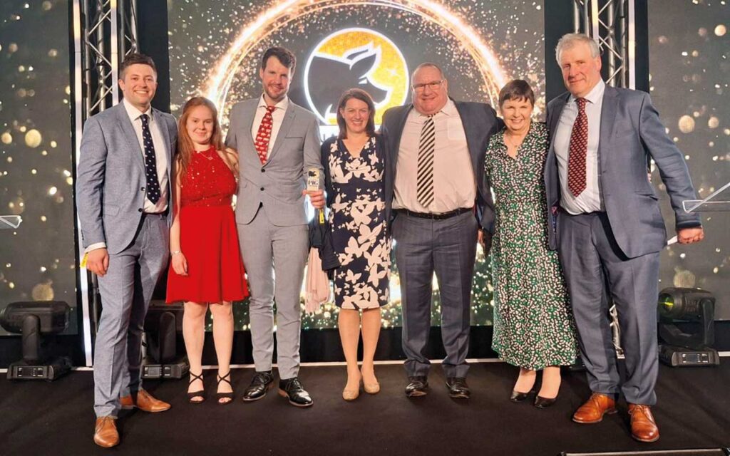 Fred celebrating his win with Nicola (second left) and the Premier Nutrition team