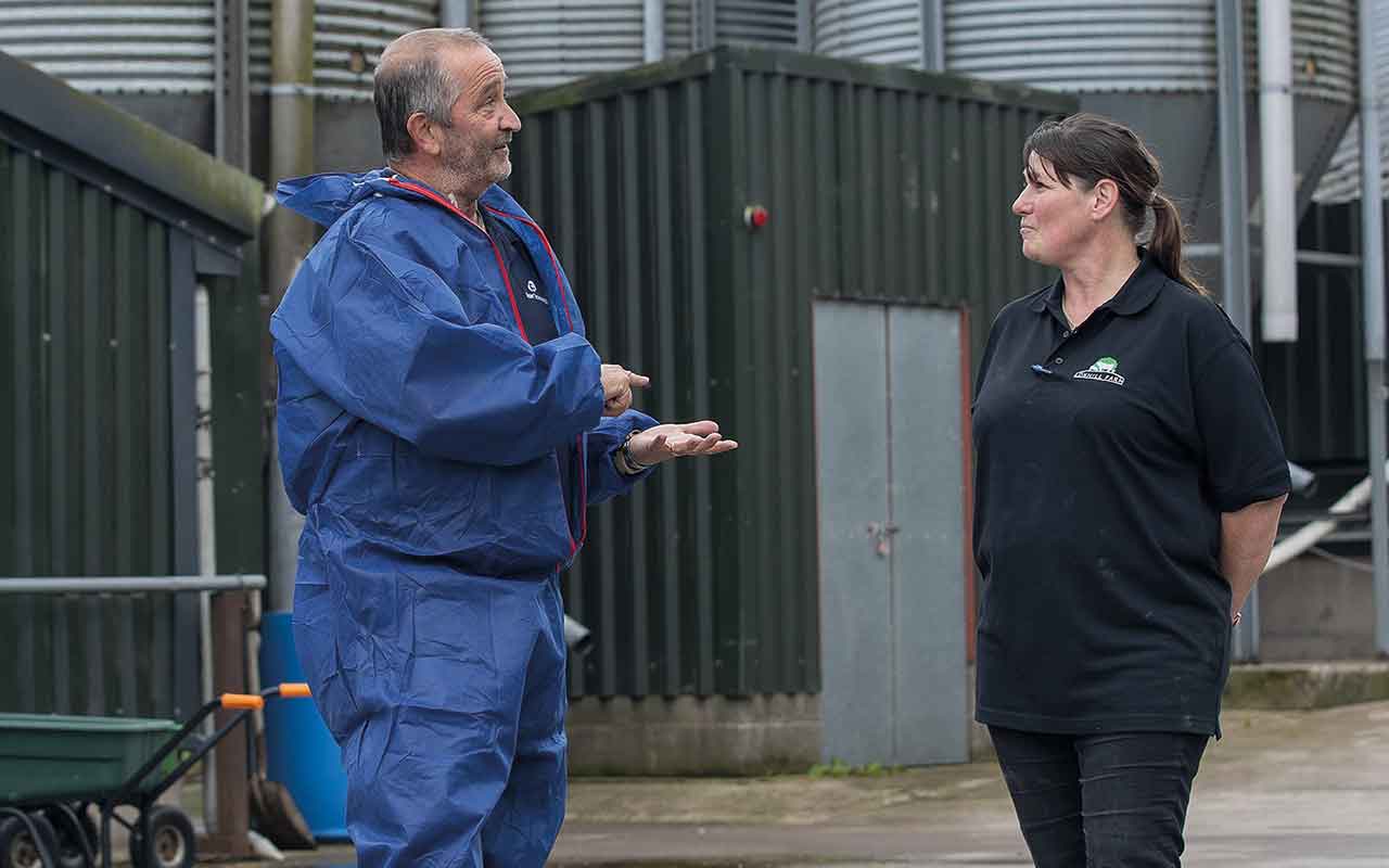 Nigel Bennet advising a farmer on biosecurity