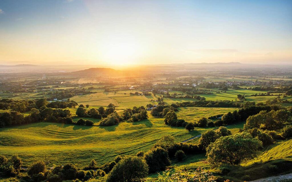 Sunset over green fields of Gloucestershire