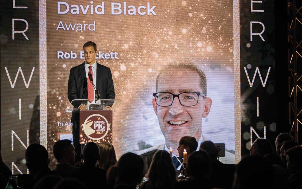 Comment: Working together for a confident, sustainable British pig industry Mark Haighton presenting the David Black Award at the National Pig Awards