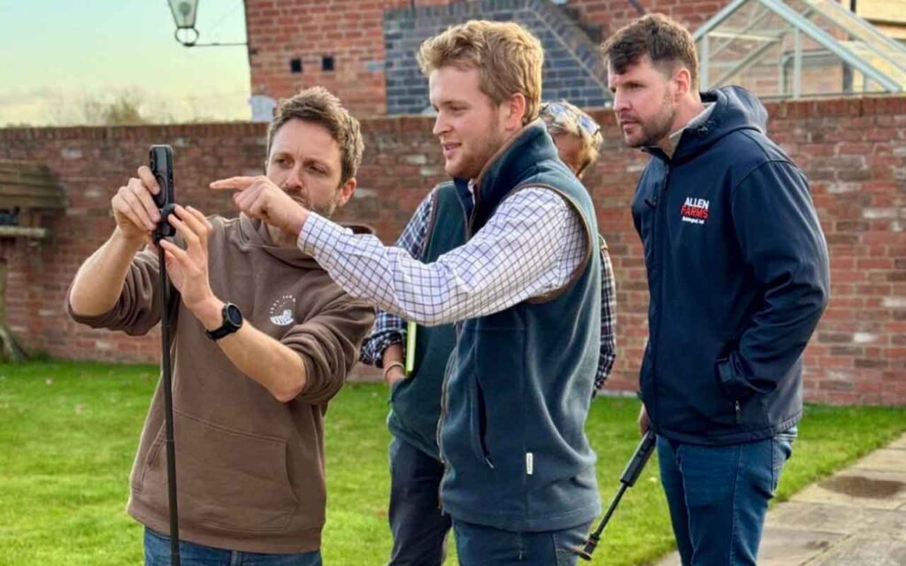 Three men with camera