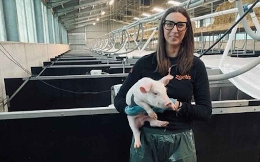 Emma Wormington holding a piglet