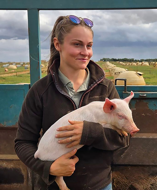 China Smith holding piglet